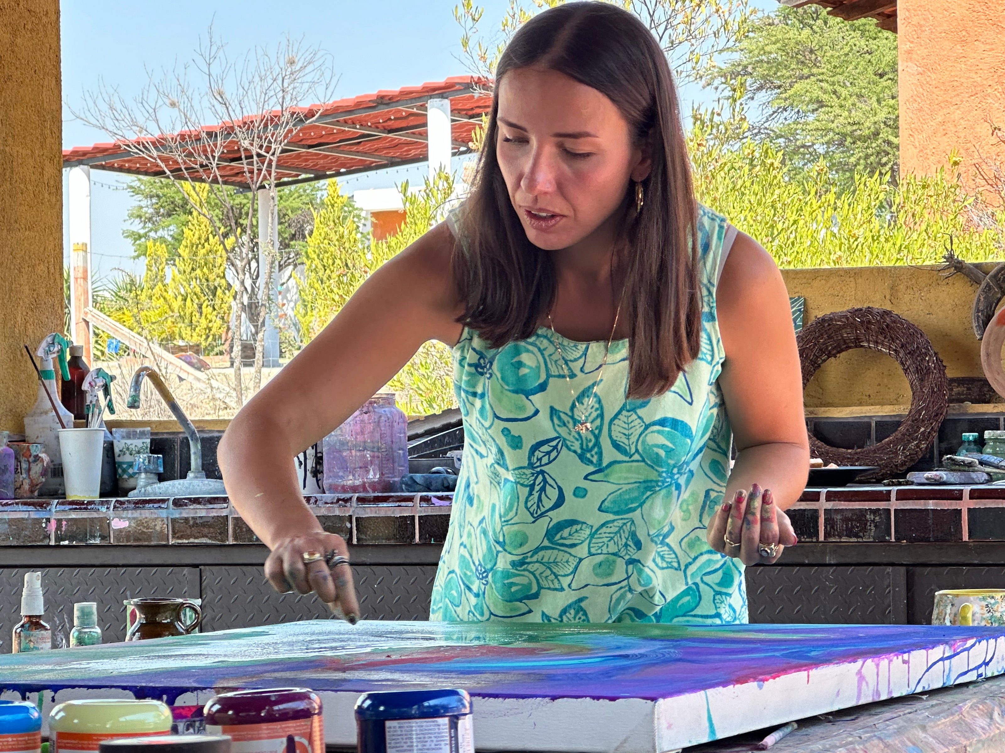 Art_Mexican_Alexandra_Schurmann_Belendez_The_Process_Magic_is_not_Logic_painiting_with_artist_in_action_wide_angle_adding_gold
